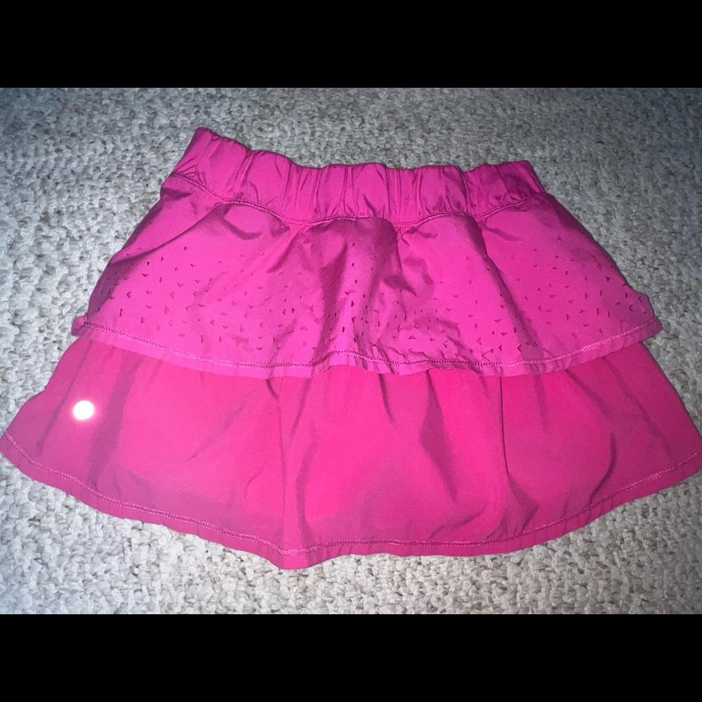 Lululemon pink skirt. Size 6 no rips or tears. 13 inches long. No fading.